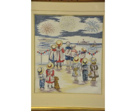 An attractive framed tapestry picture depicting Victorian children looking out to sea. 