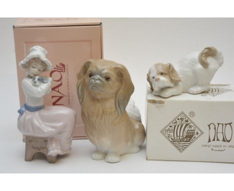 Two boxed Nao figures comprising a seated girl and a dog, together with an unboxed Lladro figure of a Pekinese dog