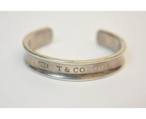 A ladies silver bangle by Tiffany & Co.