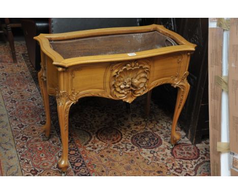 A fine quality carved oak plant trough with metal liner by Jas Schoolbred