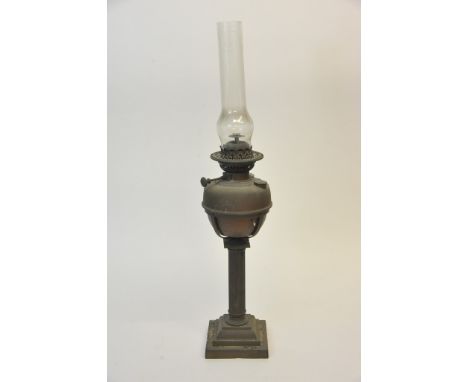 A brass oil lamp with fluted column. 