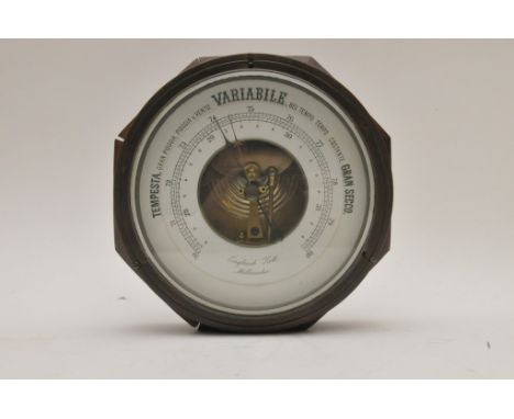 An oak wall barometer and a collection of eight mantel clocks and two wall clocks. 