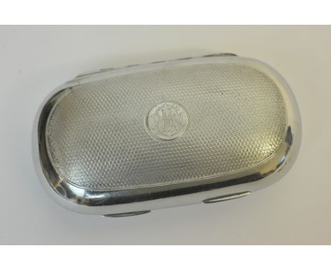 A Victorian silver case with engine turned finish of oval form