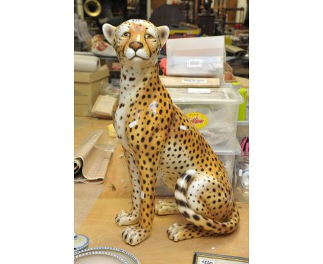 A large ceramic Cheetah figure. Measures approx 26" in height. 