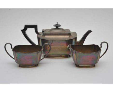 A silver three piece tea set bearing Sheffield hallmarks