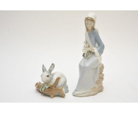 A Lladro model of a rabbit and figure of a girl with flowers