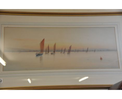 A gilt framed water colour depicting sailboats with mountains beyond by Graham Morris 