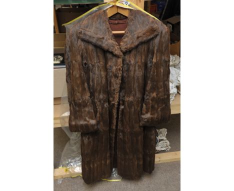 A ladies fur coat and hat