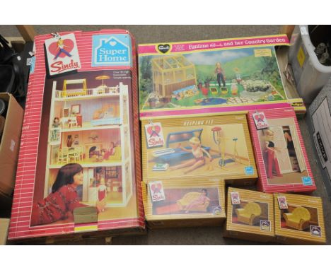 A collection of vintage Sindy doll accessories, boxed. Including the extendable super home house, Keeping fit, sofa, armchair