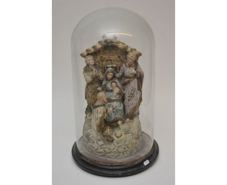 A large Victorian bisque religious figure group under a glass dome