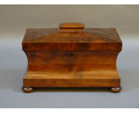 A Regency mahogany tea caddy, of sarcophagus form, with mixing bowl