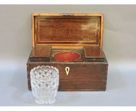 A 19th century mahogany tea caddy, with twin compartments, and centred with cut glass mixing bowls, 31cm wide