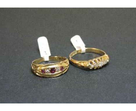 An 18ct gold ruby and diamond ring, and an 18ct gold five stone diamond boat shaped ring