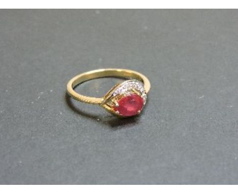 A 9ct gold pear shaped ruby and diamond ring