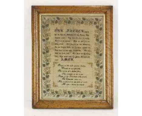 A mid 19th century sampler, the open weave linen background hand embroidered with 'The Lord's Prayer', with coloured silks an