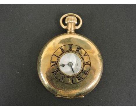 A rolled gold half hunter pocket watch, marked to the case 'Empress'