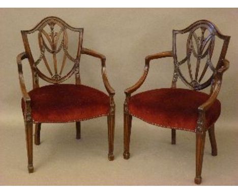 Two Chippendale style shield back chairs, with red upholstered seats