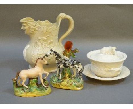 Two Staffordshire figures, including one of a pony painted black with spill vase, a Machin & Potts moulded stoneware jug, and