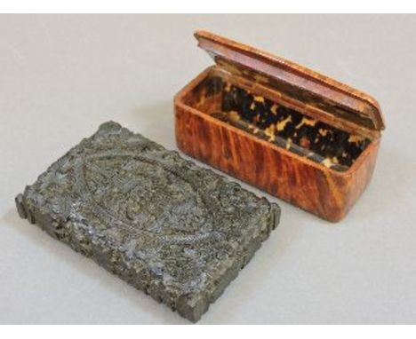 A 19th century tortoiseshell lined snuff box, and an Indian carved wood card case