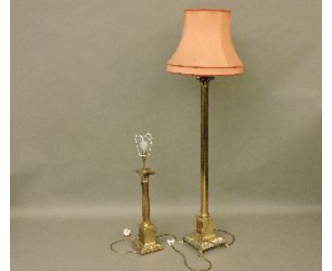 A modern brass Corinthian column standard lamp, and a matching table lamp