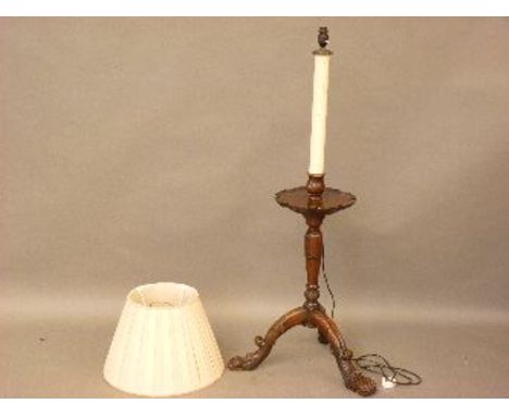 A 19th century and later mahogany lamp table, with turned column on three downswept legs, with lion's paw feet, 128cm overall