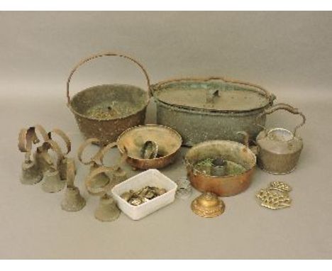 A quantity of copper and brassware, including a lion's head door knocker, and butler's bells