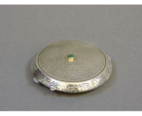 A sterling silver compact, by S J Rose, with engine turned and hand engraved decoration, and an emerald rub set to the lid