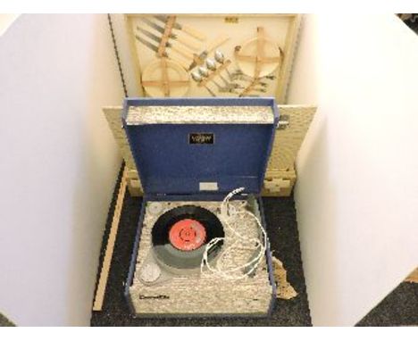 A 1960s Dansette record player, and a vintage picnic set, retailed by Harrods