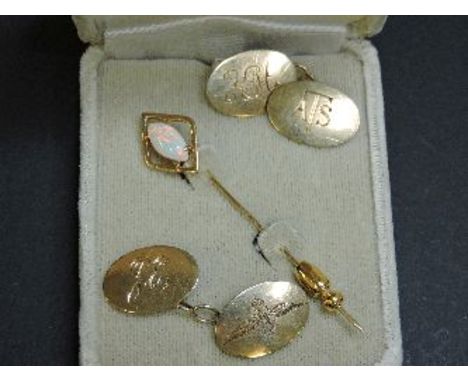 A gold opal set stick pin, tested as approximately 14ct gold, and a pair of 9ct gold cufflinks