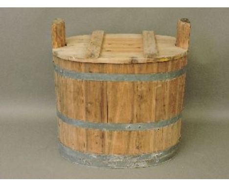 A large oval coopered trough and lid