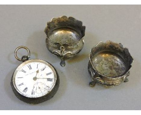 An open faced pocket watch, glass severely cracked, and a pair of silver salts, no liners