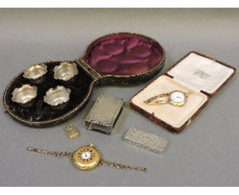 Four cased silver salts, a match box holder, a silver snuff box, and three watches