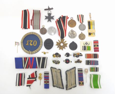 Bestehend aus zahlr. Abzeichen etc.: Verwundetenabzeichen in  Schwarz, hohl. Kriegsverdienstkreuz 1939 mit Schwertern 2. Kl.,