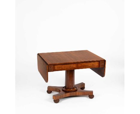 A Regency rosewood sofa table, fitted a pair of frieze drawers and drop-down sides, on turned column and quadriform base, 95c
