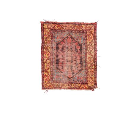 A Demirci Kula rug, West Anatolia, mid to late 19th Century, the charcoal field of vines issuing palmettes and urns with flow