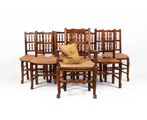 A closely matched set of Victorian spindle back dining chairs, seven singles and one carver, mixed timbers including ash and 