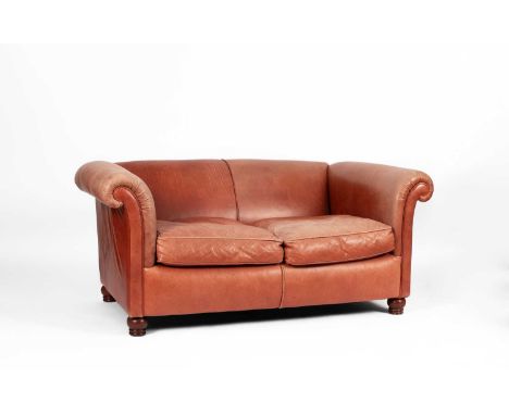 A Chesterfield style leather upholstered two-seater sofa, 20th Century, on turned wooden feet, 170cm wide, 96cm deep, 70cm hi