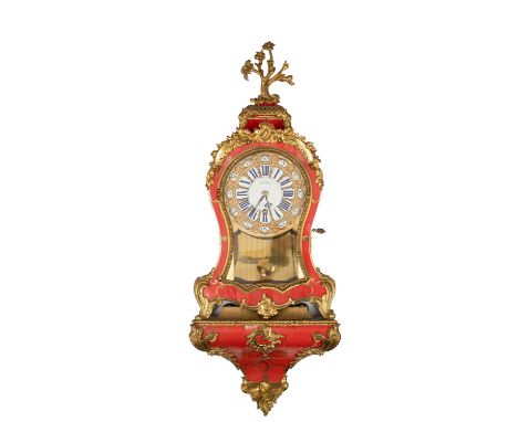 A Louis XV corne rouge quarter repeating timepiece with bracket, gilt embossed dial with Roman hour and Arabic minute enamel 