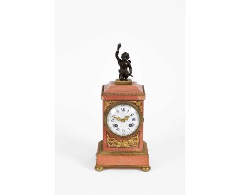 A 19th Century French pink marble and gilt brass clock by Richond of Montmartre, the top with bronze cherub figure, the white