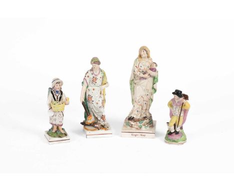 A pearlware figure of the Virgin Mary, another of Peace and two 19th Century Staffordshire figures, the first 23.5cm highMary