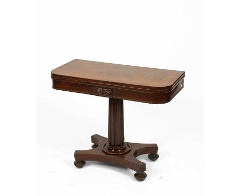 A George IV mahogany fold-over card table, the crossbanded rectangular top with rounded corners, opening to reveal a circular