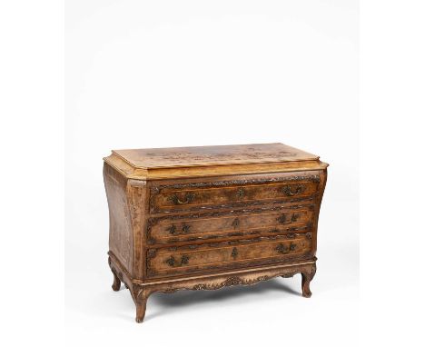 A French walnut commode, fitted with three long drawers with carved borders, on shell capped legs with scroll feet, 130cm wid