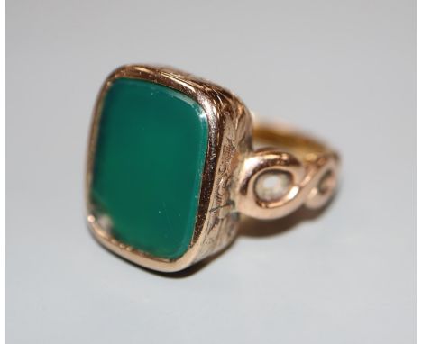 A 19th century yellow metal and chrysophase? set signet ring, size M, gross 7.2 grams.CONDITION: There is a large chip to one