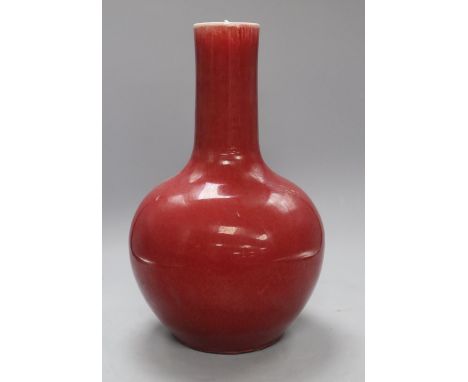 A Chinese sang de boeuf bottle vase, height 34cmCONDITION: There is light crazing throughout as well as some scuffing and wou