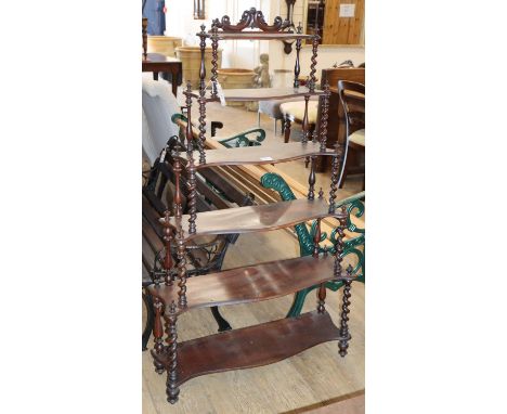 A Victorian style rosewood six shelf serpentine fronted whatnot, W.80cm, D.26cm, H.140cm