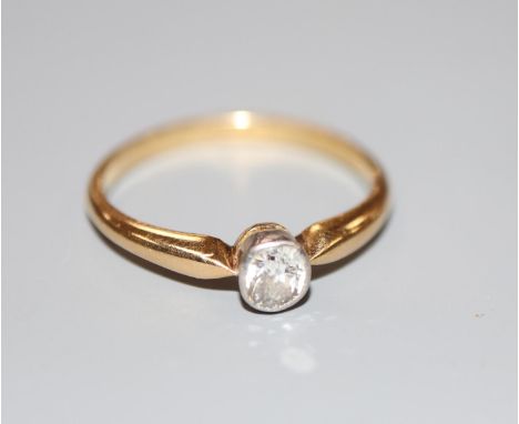 An 18ct and millegrain set solitaire diamond ring, size N, gross 2.5 grams.CONDITION: Stone size approx. 0.18-0.20ct.