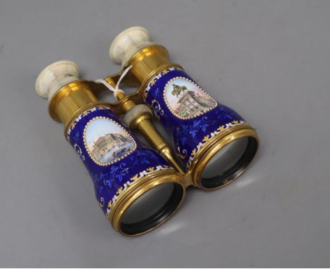 A pair of gilt brass and enamel opera glasses, with mother of pearl overlay and painted Italian scenes, length 13.5cm (a.f.)