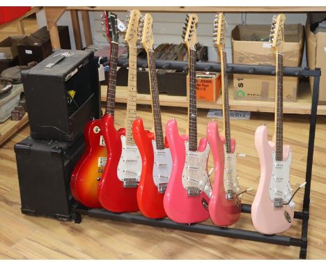 An Encore Les Paul style electric guitar, a Westwood Strat-style electric guitar, a Marlin electric guitar, a Zennox electric