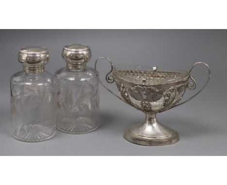 A pair of Edwardian silver mounted etched glass scent bottles, 16cm and a continental white metal boat shaped two handled ped