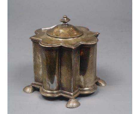 A George V silver tea caddy, of lobed form,on shell feet, Pairpoint Brothers, London, 1911, 12.5cm, 16 oz.CONDITION: Quite ta